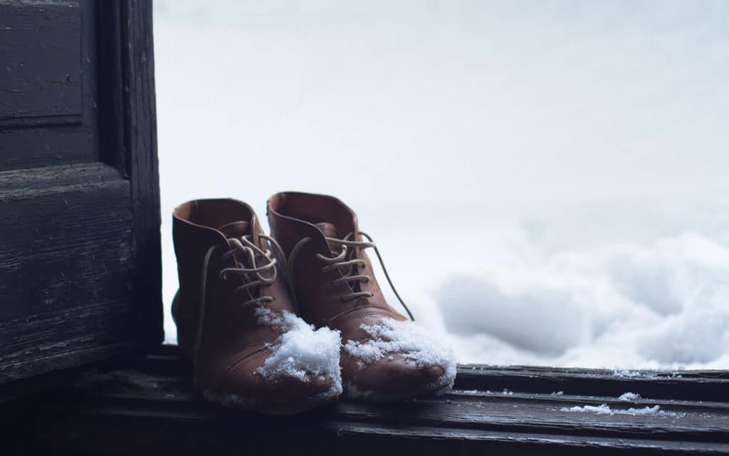 boots at door on snowy day
